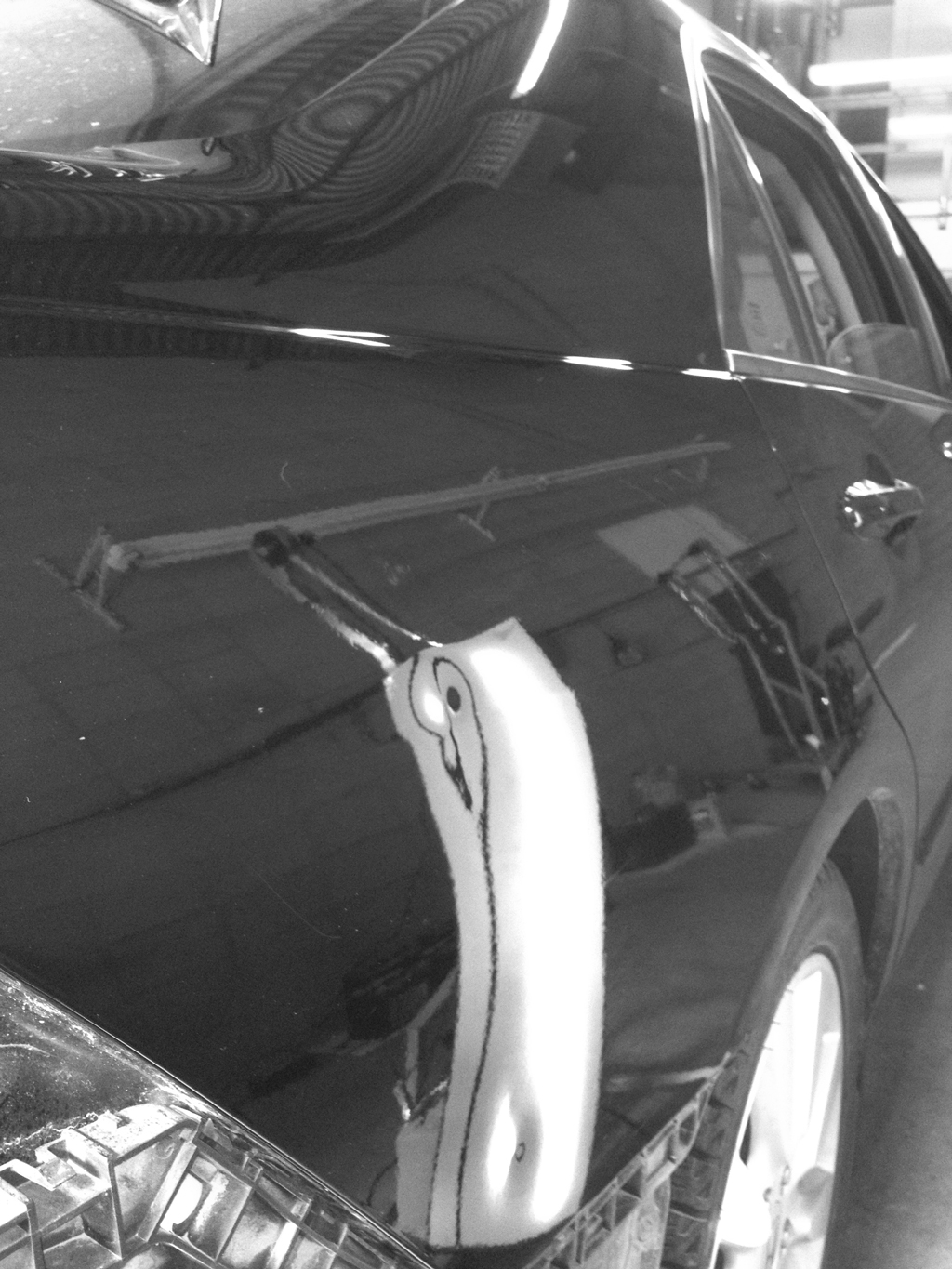 Before image of dent in rear quarter panel