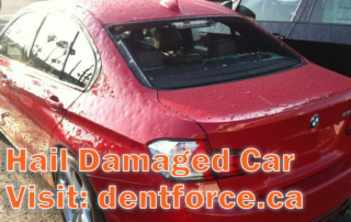 Red bmw with hail damage
